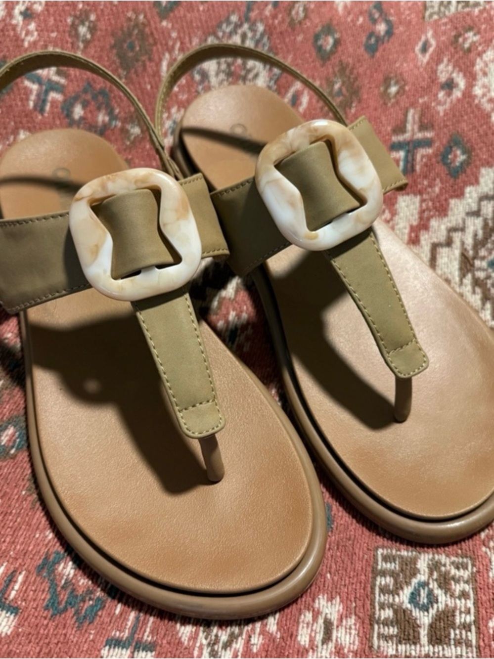 Olukai La’i T-bar sandal with tortoise resin accent buckle in tan